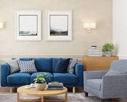 Cozy living room with warm lighting, sofa, and shelf decor.